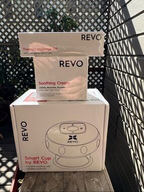 REVO CUPPING DEVICE W/Soothing Cream & Massage Oil. 
New in boxes